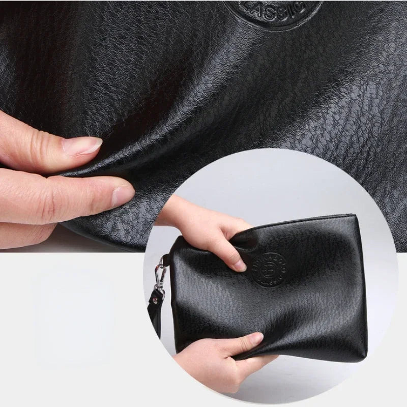 A hand is holding a black PU leather men's clutch wallet.