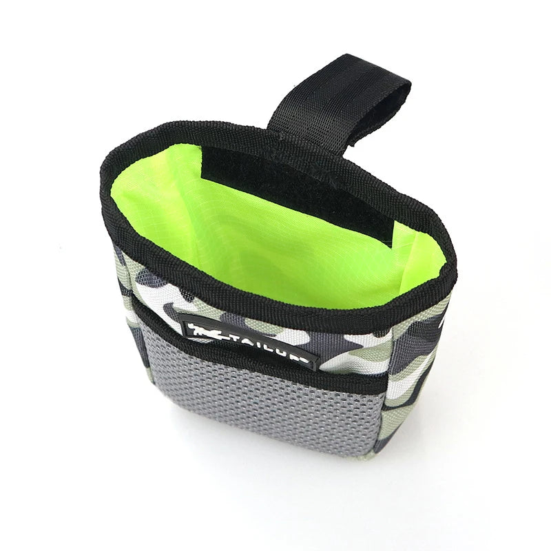 A black pet training treat pouch with a lime green interior and a camouflage exterior.