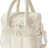 A cream-colored quilted insulated lunch bag with carrying handles and zippered compartments.