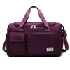 A purple large capacity travel duffle bag with shoulder straps and a zippered compartment.