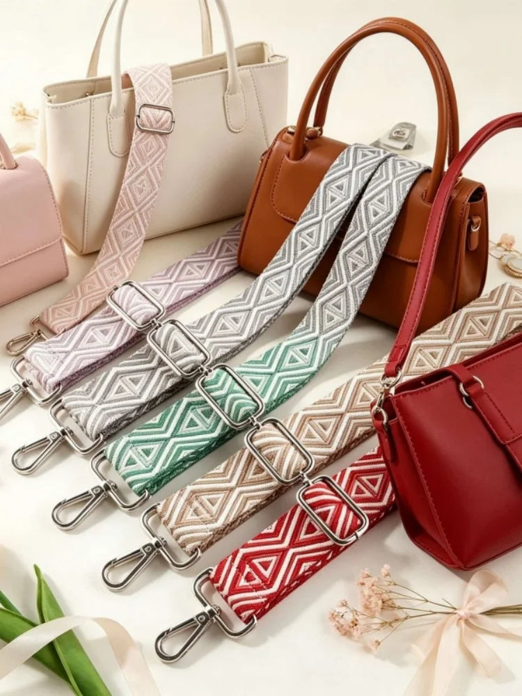 A collection of adjustable nylon shoulder straps in various patterns and colors laid out on a white surface.