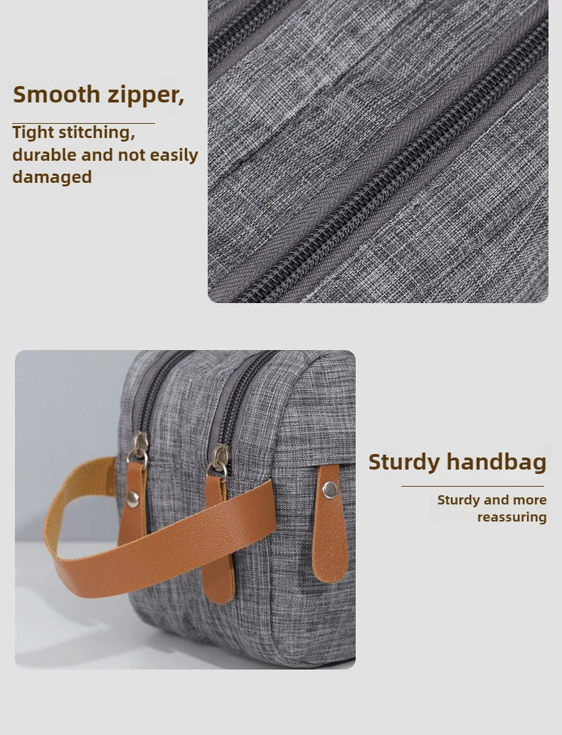 A gray portable travel storage pouch with a smooth zipper and tan leather strap.