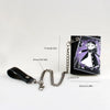 A black tri-fold chain card holder wallet with a purple and white illustration of a girl.