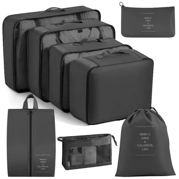 A set of multi-size mesh packing cubes and a drawstring bag in gray for travel organization.