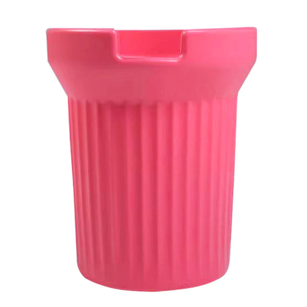 A bright pink silicone boot sleeve designed to fit water bottles.