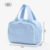 Light blue multipocket travel toiletry bag with padded handles and zipper.