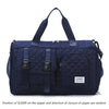 Navy nylon travel duffle bag with a quilted argyle pattern and dark handles