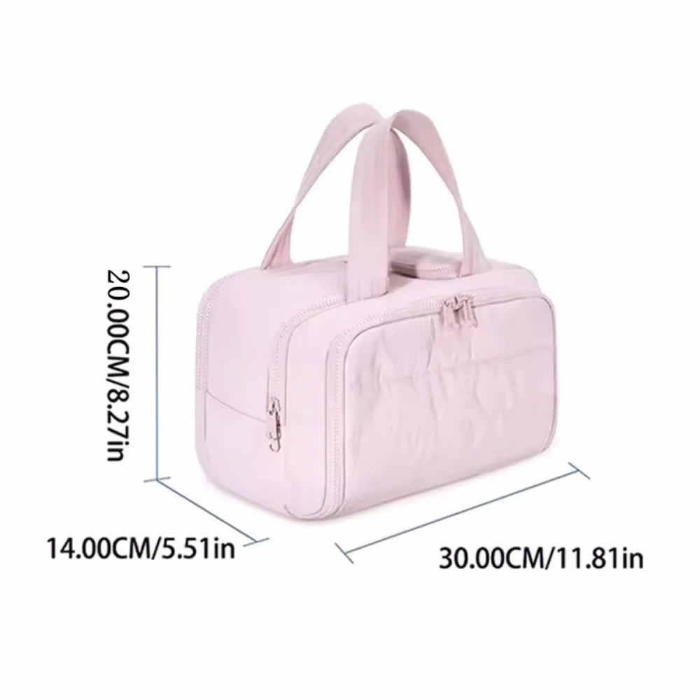 Bolsa impermeable de tocador rosa claro con múltiples bolsillos y cierre de cordón y correas para llevar