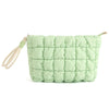 A light green quilted puffer makeup bag with a fabric strap is shown.