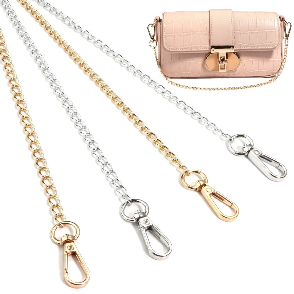 A collection of adjustable gold and silver chain straps for handbags, including a pink leather purse.
