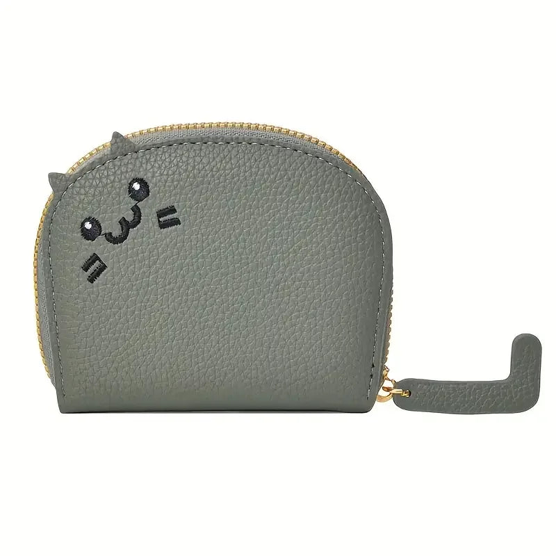 A light gray faux leather multi-card wallet with a cartoon cat face design and gold zipper.