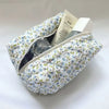 Bolsa de maquillaje acolchada con cremallera floral para guardar frascos de perfume y cosméticos