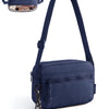 A navy blue crossbody shoulder bag with a leather strap and a zippered pocket is shown against a white background.