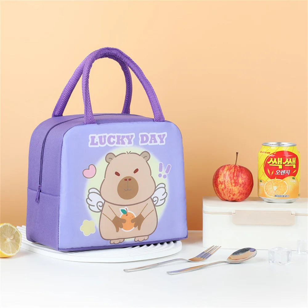 Purple insulated lunch bag featuring a cartoon capybara design on a white plate.