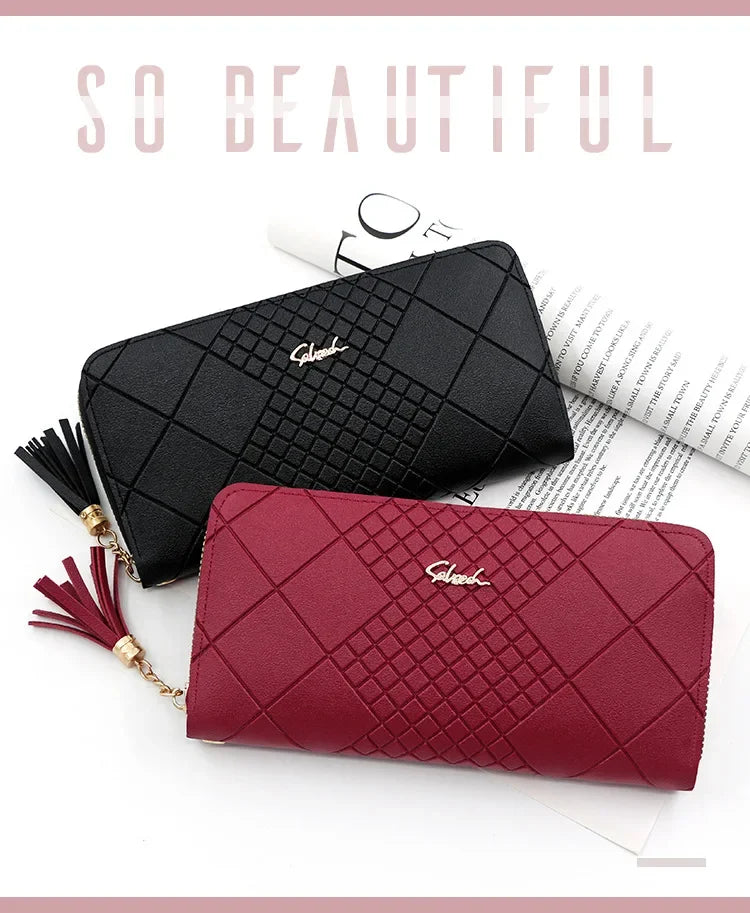 A close-up of a black quilted clutch wallet and a maroon quilted clutch wallet with gold chain details.