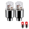A pair of LED tire valve stem lights with silver bases and clear glass bulbs.