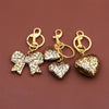 Gold-toned leopard print bow and heart bag charm keychain