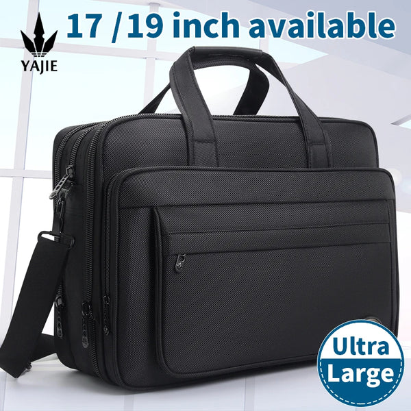 Black durable canvas business laptop briefcase with adjustable straps and zipper details.