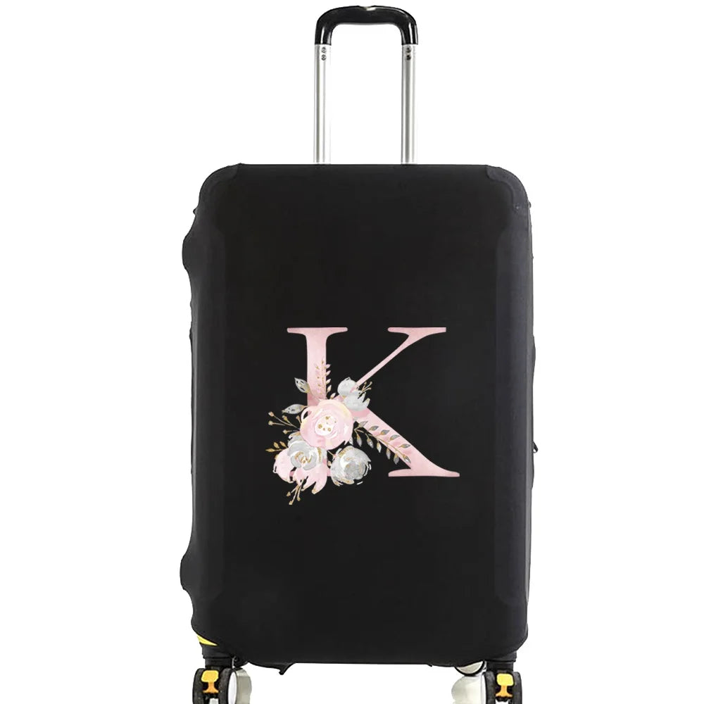 Black luggage with a pink floral monogram design and silver handle.