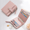 A pink PU leather mini card holder wallet with a zipper and a flap, displaying various cards.