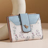 A light blue and white patterned fashion PU leather slim card holder wallet displayed on a white mannequin.