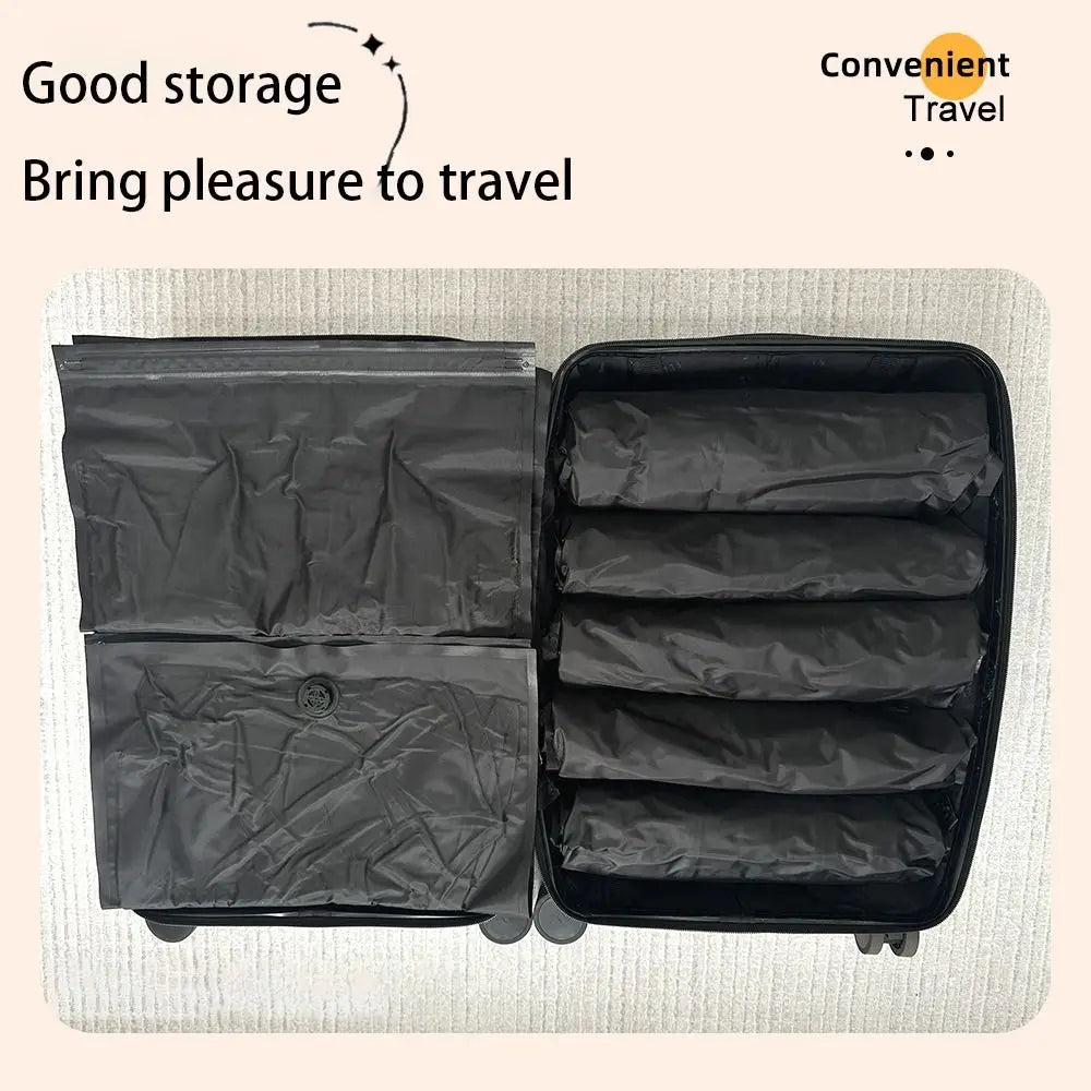 A black reusable vacuum storage bag with multiple compartments is shown on a light surface.