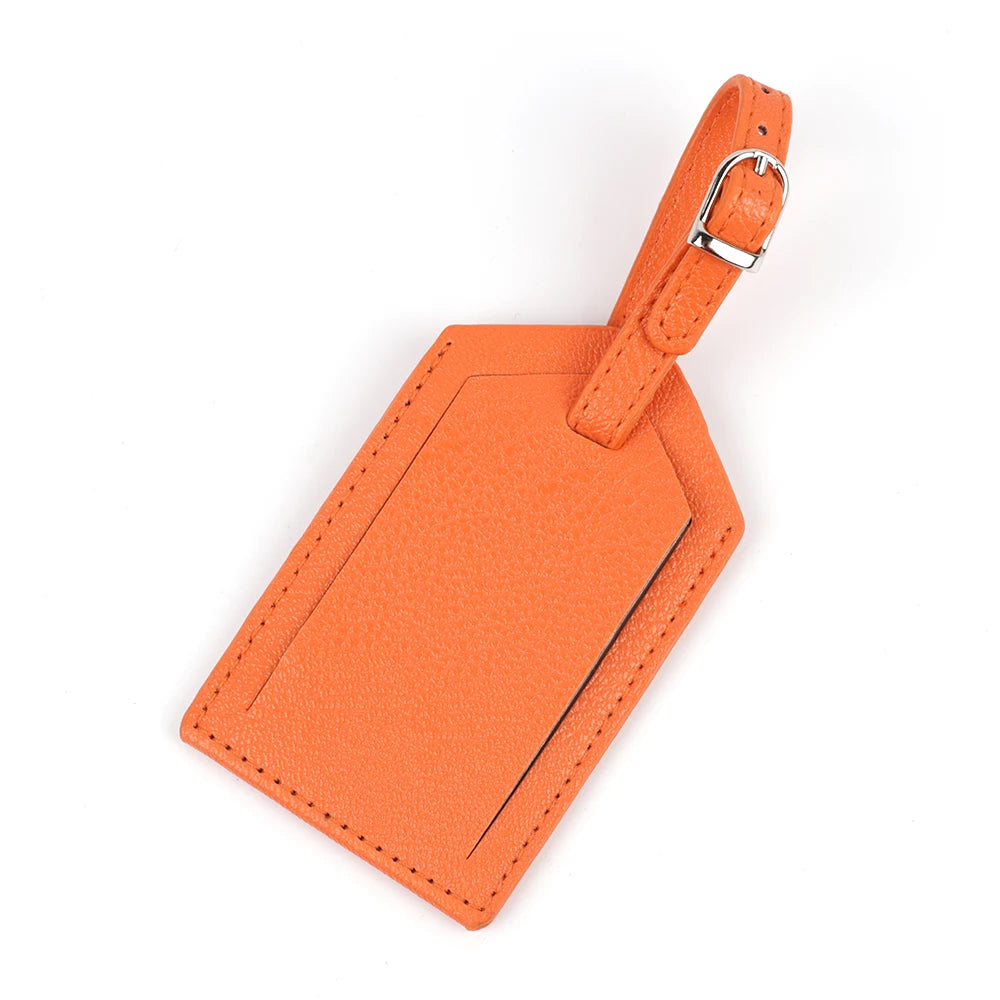 An orange PU leather luggage tag with a leather strap and silver buckle.