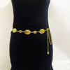 Vintage gold plated sunflower smiley face waist chain displayed on a black background.