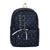 Navy blue corduroy backpack with white polka dots and a light beige strap