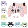 Various silicone grip covers in purple, pink, and green for a PlayStation controller.