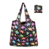 A black reusable shopping bag with colorful dinosaur and animal prints.