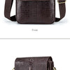 Dunkelbraune Lederhandtasche mit Vintage-Krokodillenmuster, Frontansicht.