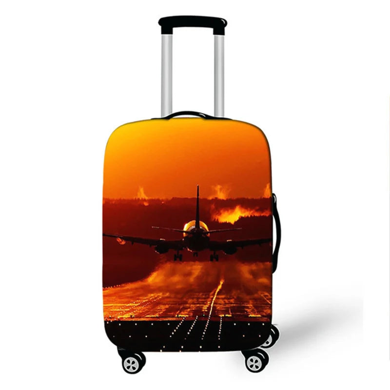 A black suitcase with an orange sunset graphic featuring an airplane silhouette over a city skyline.