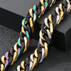 A pair of chunky gold and black Cuban link bracelets displayed on a dark surface.