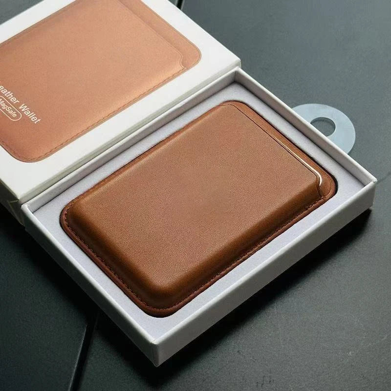 A brown leather wallet case is displayed inside its white box, showing the MagSafe compatibility feature.
