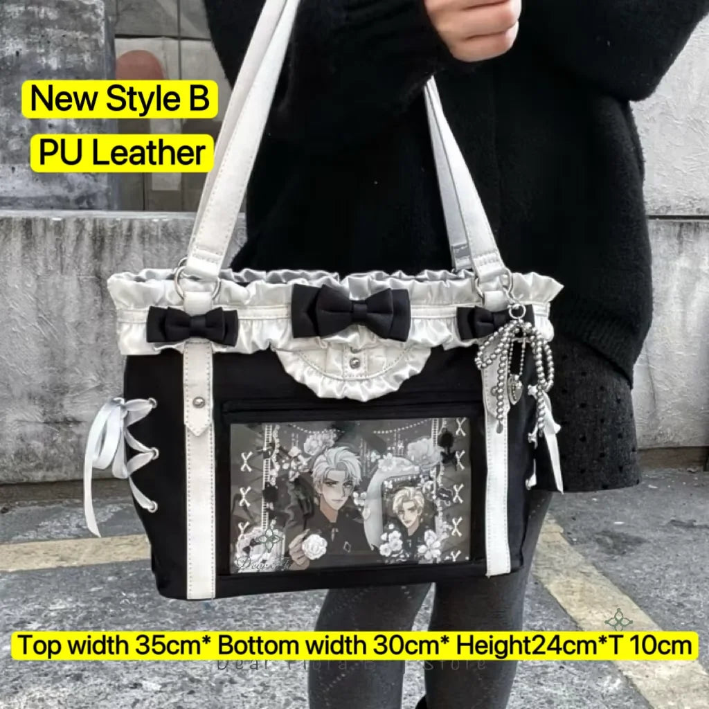 A black and silver PU leather tote bag with a bow detail being held by a person.