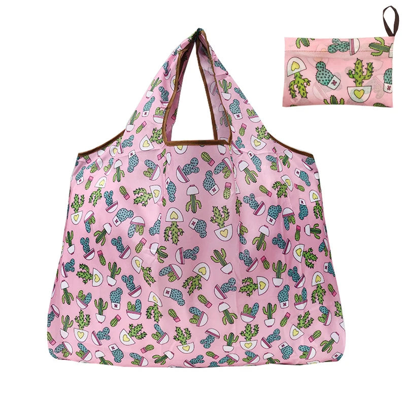 A pink reusable nylon tote bag featuring a pattern of various succulents and cacti.