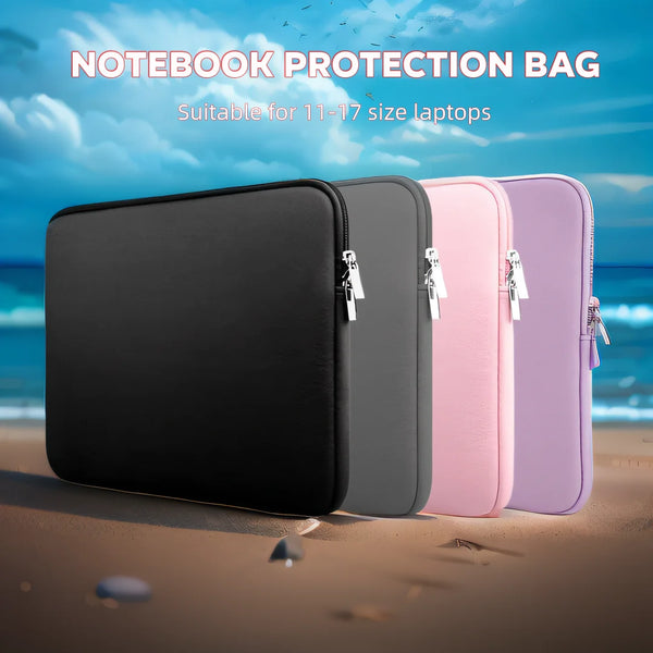 A set of multi-size laptop protection bags in black, gray, pink, and purple are displayed on a sandy beach.