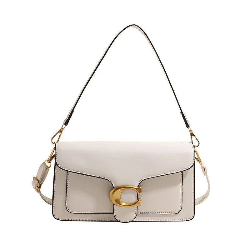 A light beige women's premium textured shoulder bag with a gold chain strap.