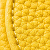 Close-up of a yellow fruit-shaped PU leather coin purse keychain with visible stitching.