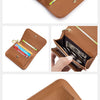 A brown genuine leather slim tri-fold wallet with a zipper pouch and gold hardware.