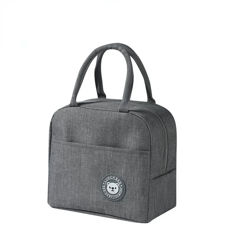 A gray reusable insulated lunch bag with carrying handles.