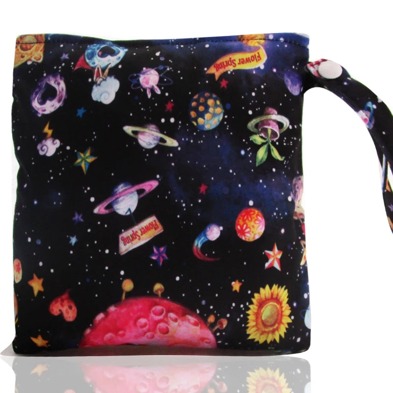 A dark fabric pouch decorated with colorful space and floral patterns, featuring a zipper closure.
