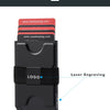 A black pop-up card wallet with a logo laser engraved on the front, shown next to various credit cards.