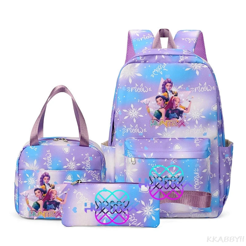 A purple multi-compartment backpack set featuring a light blue background with white snowflake and unicorn designs.