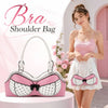 A woman models a pink polka dot bow shoulder bag with a bra silhouette in a white skirt.