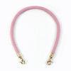Pink quilted leather bag handles with gold-toned metal buckles