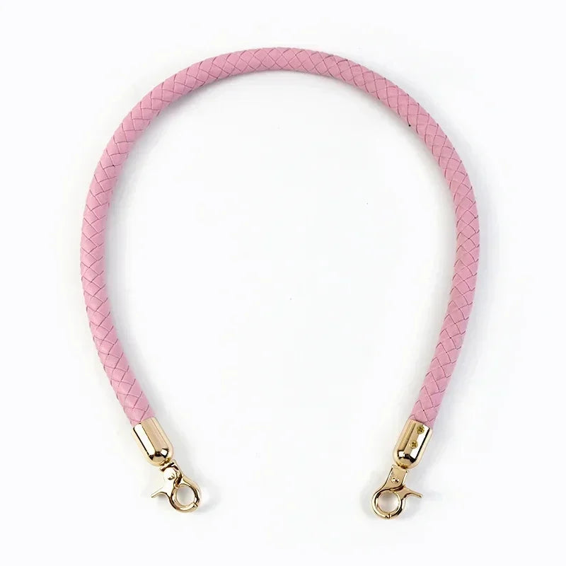 Pink quilted leather bag handles with gold-toned metal buckles