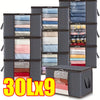 Nine dark gray foldable storage bags filled with neatly folded clothing and bedding.