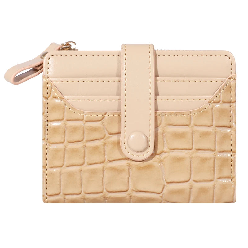 A beige PU leather card wallet with a flap closure and double zip on the front.